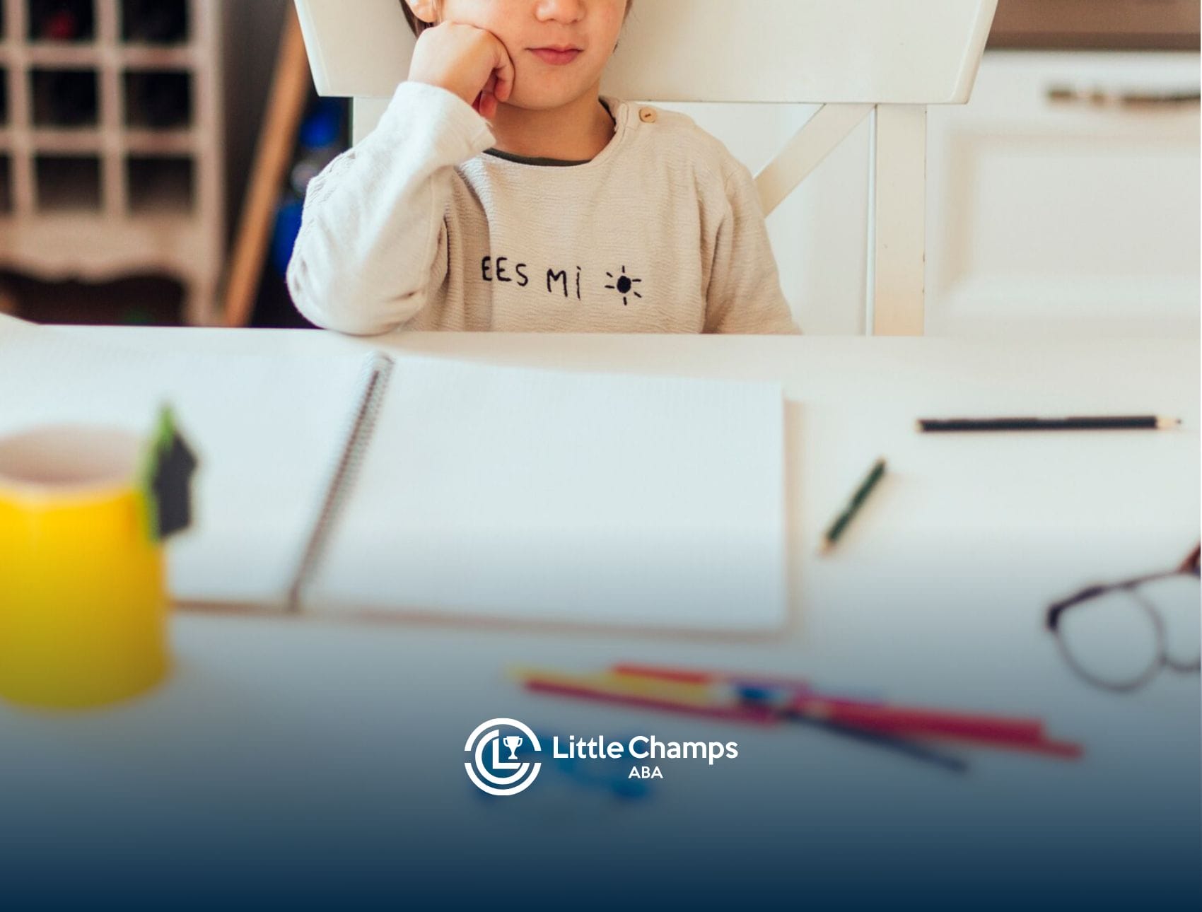 A child is sitting at a table while studying