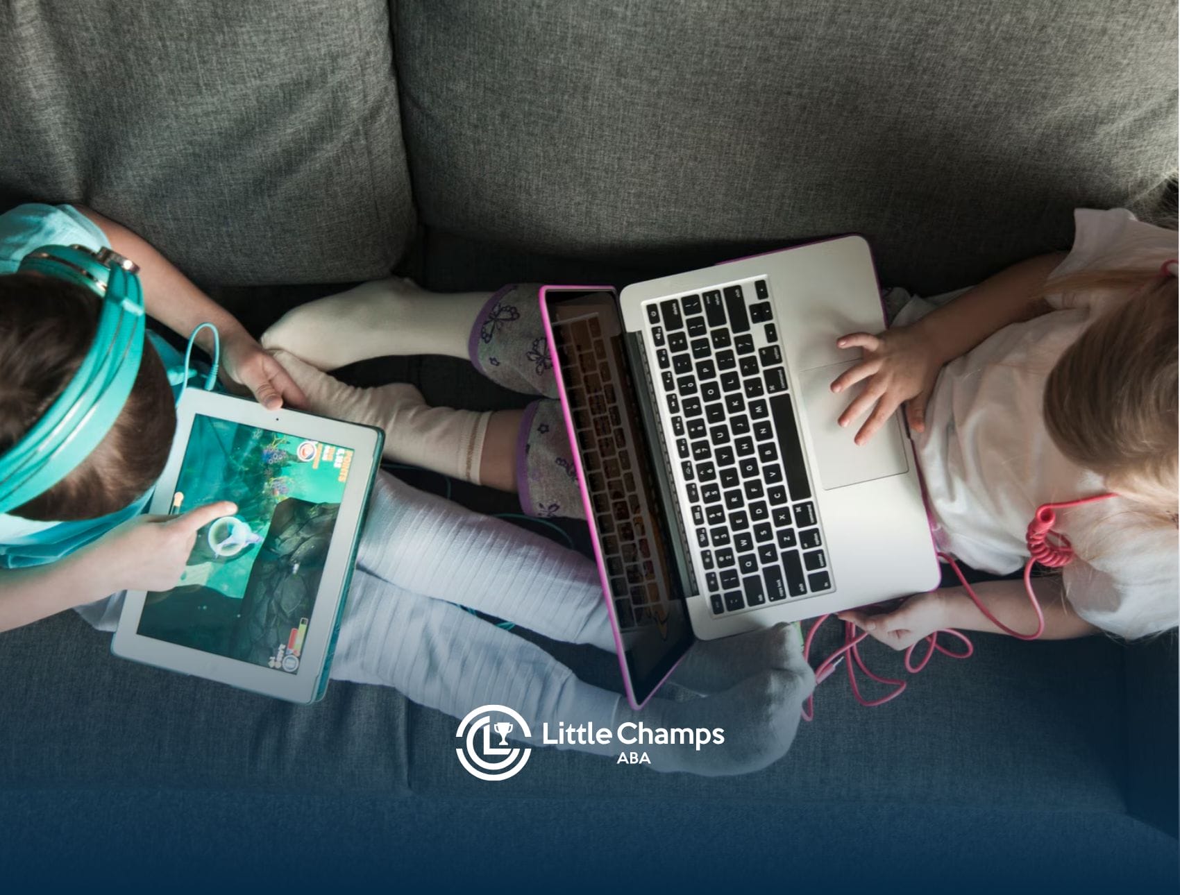 Two kids with autism aare sitting on a couch while using different gadgets for learning