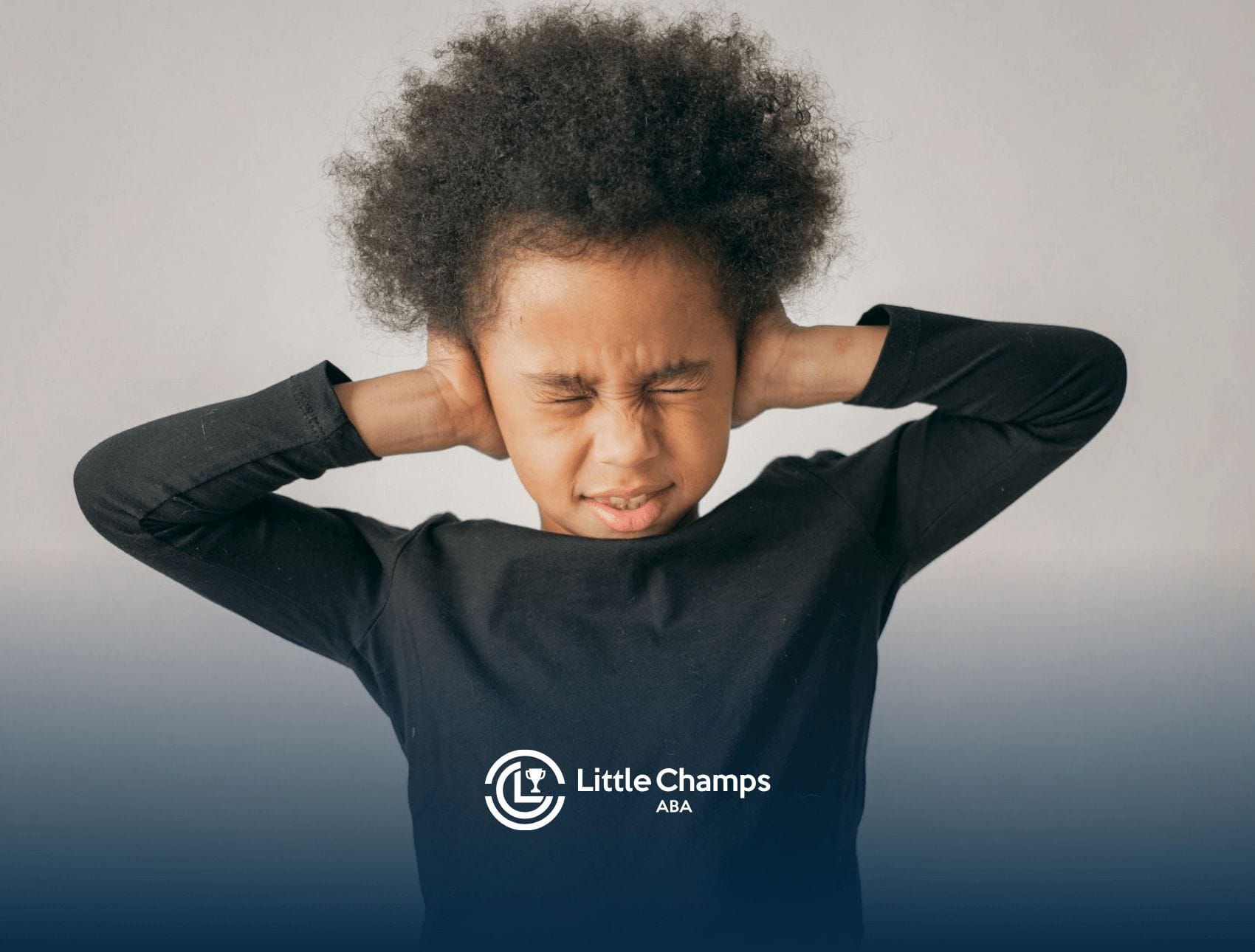 An autistic child covering ears tightly with eyes closed in discomfort during in-home ABA therapy session in UT.